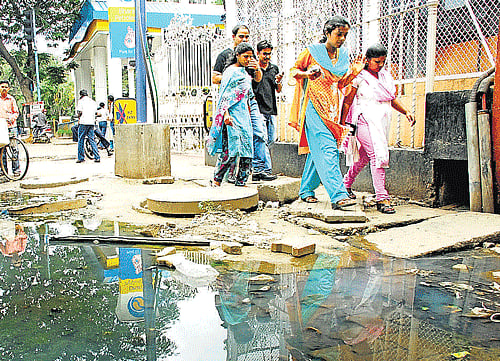 dirty: Sewage water overflowing from a manhole on MG Road.