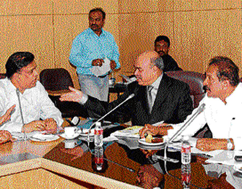 Home Minister K J George holds meeting with officers at the Vidhana Soudha on Thursday to discus Mega City Policing project. Additional Chief Secretary, Home Department, S K Patnaik, DGP CID Bipin Gopalkrishna and Bangalore City Police Commissioner Raghavendra H Auradkar are seen. dh photo