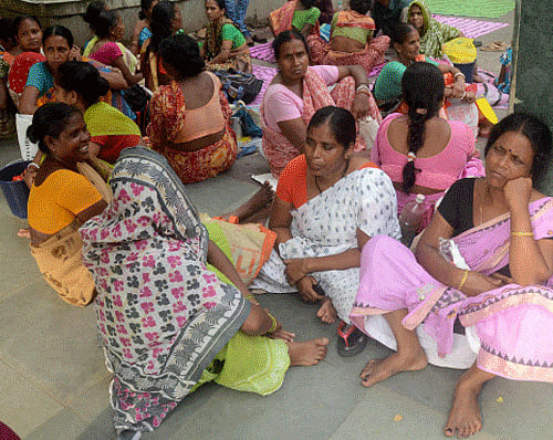 Women caretakers of the babies admitted at B C Roy Child Hospital, outside a ward of the hospital in Kolkata on Saturday. PTI Photo
