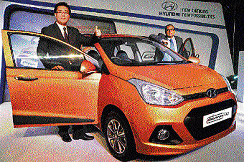 Hyundai Senior General Manager of Hyundai Y S Leem (left) and Director (Finance & Corporate Affairs) R Sethuraman launch the Grand i10 in Bangalore on Tuesday. DH Photo