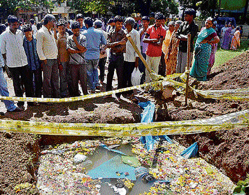 FATAL SLIP: Two children died after they fell into a deep pool meant for the immersion of Ganeshas at Gandhinagar in Dharwad on Saturday.  dh photo