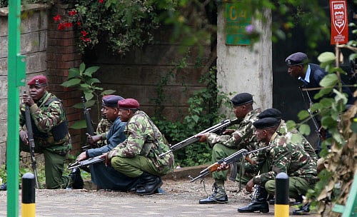 Police officers take position during the ongoing military operation at the Westgate Shopping Centre in Nairobi Reuters