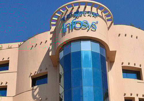 Police officials inspect the premises of Infosys after a hoax bomb call, in Mangalore on Thursday. PTI Photo