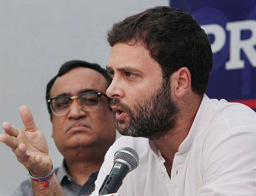 Congress Vice President Rahul Gandhi making a surprise appearance at a 'Meet the Press' programme of with party General Secretary Ajay Maken (L) at Press Club in New Delhi on Friday. PTI Photo