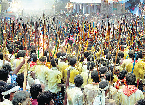 Striking a cHord: Residents of Devaragudda near Holagunda particapate in their traditional Malamalleswara Swami utsava ceremony on Monday. dh photo