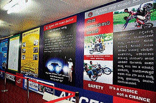 Flex boards display various warnings at the traffic police stall, at Dasara Exhibition Grounds, in Mysore. DH PHOTO