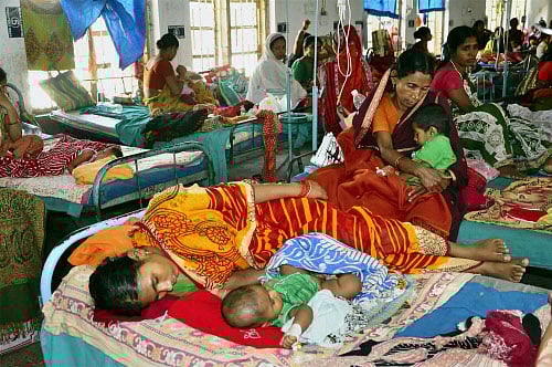 Women with their children at Malda Medical College and Hospital for treatment on Saturday. PTI Photo