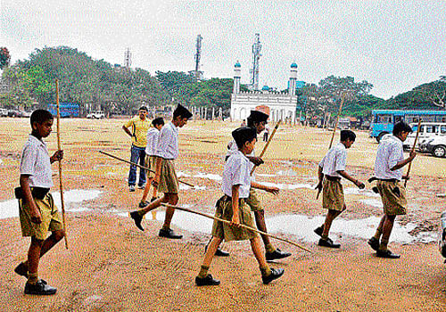RSS activists near the Idgah Maidan in Chamarajpet on  Sunday. dh Photo