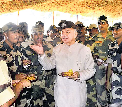 Taking stock: Union Home Minister Sushilkumar Shinde interacts with BSF personnel in Samba sector of Jammu on Tuesday. pti