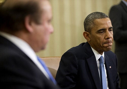 President Barack Obama listens during his meeting with Pakistan Prime Minister Nawaz Sharif in the Oval Office of the White House in Washington, Wednesday, Oct. 23, 2013. In the rocky relationship between the U.S. and Pakistan, the mere fact that Obama and Sharif sit down is seen as a sign of progress. Few breakthroughs are expected on the numerous hot-button issues on their agenda Wednesday, including American drone strikes and Pakistan's alleged support of the Taliban. (AP Photo