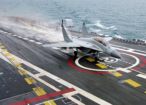 A MIG-29K fighter landing on deck of INS Vikramaditya during sailing trials at White Sea, Russia. PTI File Photo