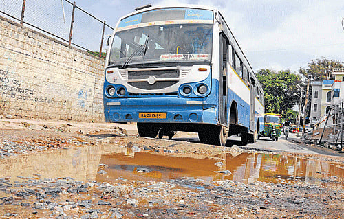 A badly damaged road in the City.