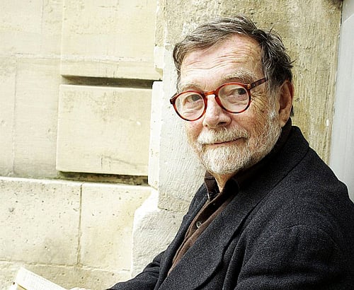 In this undated and unlocated photo provided by The New Press publishing house, Andre Schiffrin holds a book. Schiffrin, who was expelled from the corporate publishing world after fostering the likes of Art Spiegelman, Jean-Paul Sartre, Studs Terkel and Noam Chomsky, has died in Paris. The New Press, a nonprofit publisher that Schiffrin founded after he was forced out of Pantheon Books in 1990 over the high-brow imprint's slender bottom line, said he died Sunday Dec.1, 2013 of pancreatic cancer. He was 78. AP