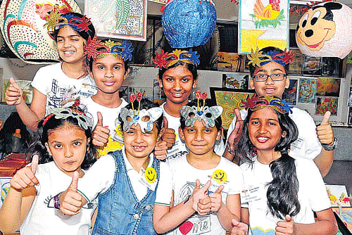 merriment: Children participate in the third annual exhibition of Saakar Arka Fine Arts at the Rangoli Metro Art Centre in Bangalore on Saturday. dh photo