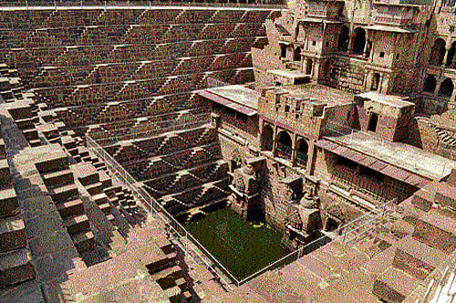 Lost relics: The Chand Baori in Abhaneri; (below) locals perform their everyday chores at the well. (Courtesy TWF)