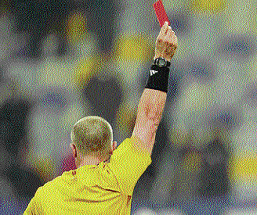 flash the red!: Officials have to be ever alert to nab the cheats who are on the lookout for chances to make quick money. afp