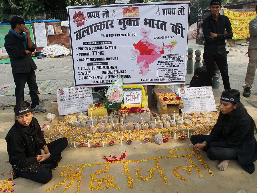People light candles to pay tributes to Damini, the victim of the gang-rape, on the first anniversary of the horrendous incident at Jantar Mnatar in New Delhi on Monday. PTI Photo