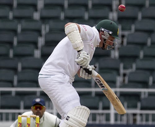 South Africa's captain Graeme Smith, avoids a bouncer from India's bowler Mohammad Shami, during the second day of their cricket test match at Wanderers stadium in Johannesburg, South Africa, Thursday, Dec. 19, 2013. AP Photo
