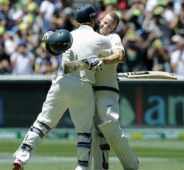 Chris Rogers being congratulated by Shane Watson after scoring a century against England in the fourth Ashes Test at MCG on Sunday. Australia won the match by 8 wickets and led the series 4-0. AP