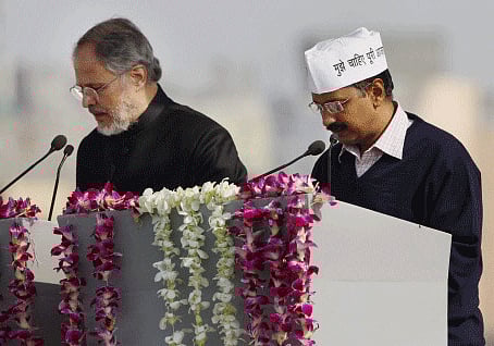 AAP leader Arvind Kejriwal taking oath. PTI Photo