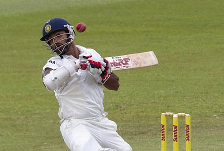 India's Shikhar Dhawan ducks a short ball during the fourth day of the second cricket test match against South Africa in Durban, December 29, 2013. REUTERS