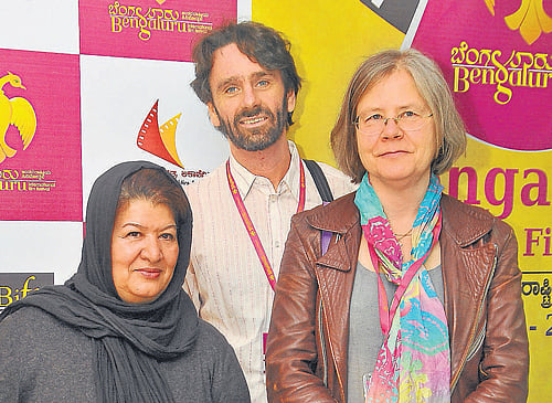 Keen: Pouran Derakhshandeh, Jouko Seppala and Taru Makela. DH photo by BK Janardhan