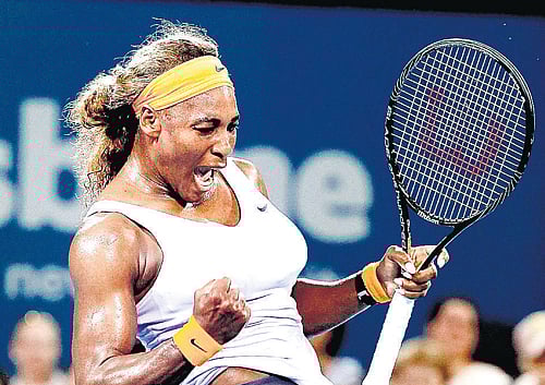 Brute force: Serena Williams exults after recording her 14th consecutive win over Maria Sharapova at the Brisbane International on Friday. Reuters