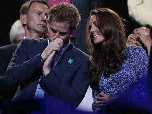 Britain's Prince Harry (Left) may be planning to move next door to elder brother Prince William (not in pic) and wife Kate Middleton (Right) . Reuters