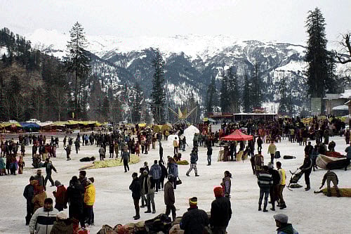 Tourists enjoying fresh Snowfall at Solang Nala in Manali. PTI Photo
