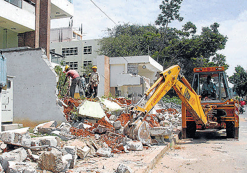 Properties are demolished for road-widening but, without cash compensation.