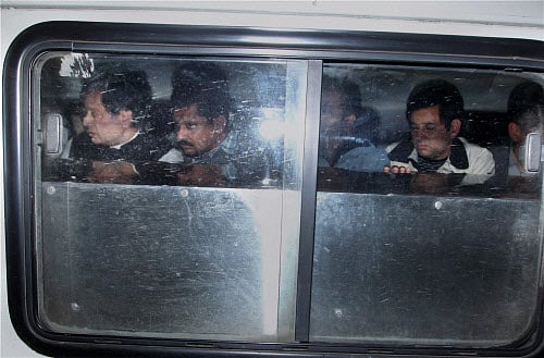 Union Minister Shashi Tharoor carries the body of his wife Sunanda Pushkar Tharoor to AIIMS in New Delhi on early Saturday morning. PTI Photo by Shirish Shete