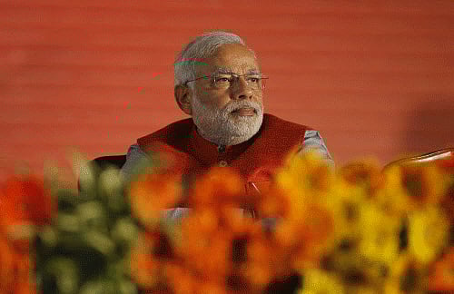 Bharatiya Janata Party (BJP) prime ministerial candidate Narendra Modi attends the party's two-day long National Council meeting beginning Saturday to chalk out election strategy, in New Delhi, India, Saturday, Jan. 18, 2014. AP photo