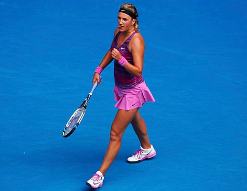 Victoria Azarenka of Belarus sticks out her tongue as she celebrates defeating Sloane Stephens of the U.S. during their women's singles match at the Australian Open 2014 tennis tournament in Melbourne January 20, 2014. REUTERS