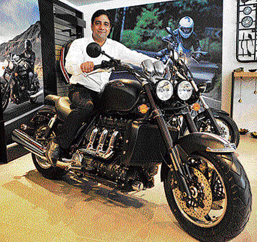 Managing Director of Triumph Motorcycles India Vimal Sumbly with a Triumph Rocket III Roadster in Bangalore on Tuesday. DH Photo/Srikanta Sharma R