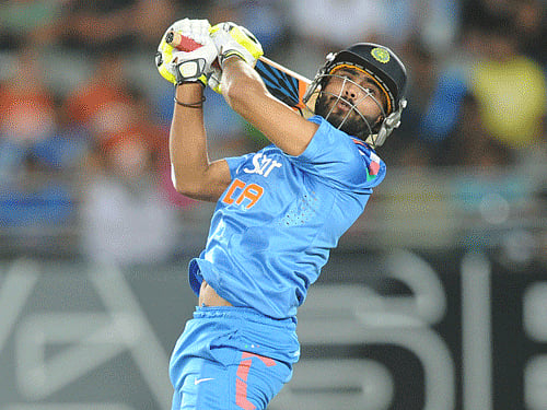 Ravindra Jadeja plays over his head against New Zealand during the third one day International cricket match at Eden Park in Auckland, New Zealand, Saturday, Jan. 25, 2014. (AP Photo)
