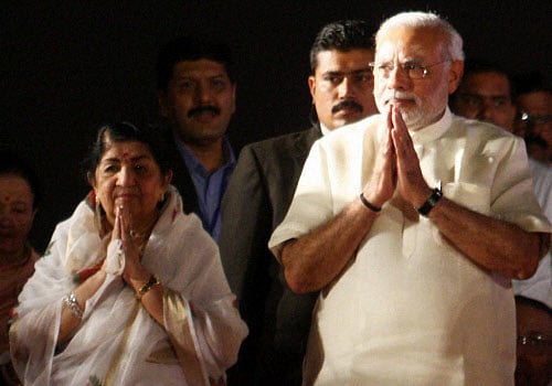 BJP's PM Candidate Narendra Modi and veteran singer Lata Mangeshkar during 'Ae Mere Vatan Ke Logo' a program to pay tributes to Indian soldiers in Mumbai on Monday. PTI Photo