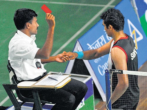 It's red for you! Anup Sridhar (right) receives a red card from the referee for smashing his racquet after his semifinal in Bangalore on Saturday. DH PHOTO