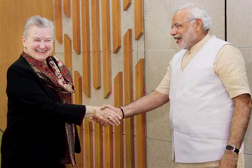 Gujarat Chief Minister Narendra Modi shakes hands with US ambassador to India Nancy Powell during a meeting in Gandhinagar on Thursday. PTI