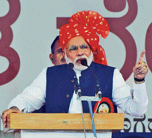 BJP's prime ministerial candidate Narendra Modi addresses a rally in Davangere on Tuesday. DH Photo