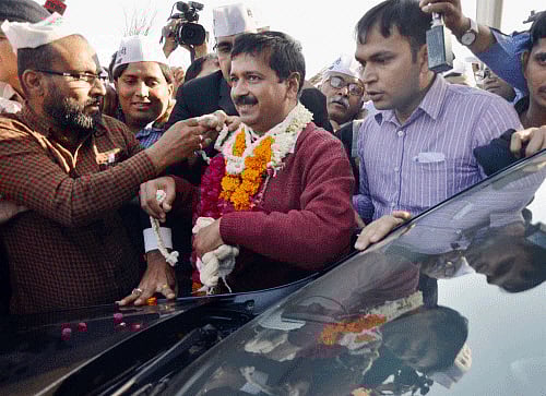 Aam Aadmi Party (AAP) chief Arvind Kejriwal with supporters during his election campaign in Ahmedabad on Wednesday. PTI Photo