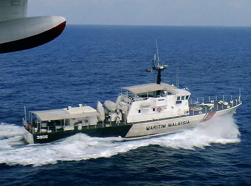 In this photo released by Malaysian Maritime Enforcement Agency, a patrol vessel of Malaysian Maritime Enforcement Agency searches for the missing Malaysia Airlines plane off Tok Bali Beach in Kelantan, Malaysia, Sunday, March 9, 2014. Military radar indicates that the missing Boeing 777 jet may have turned back, Malaysia's air force chief said Sunday as scores of ships and aircraft from across Asia resumed a hunt for the plane and its 239 passengers. (AP Photo)