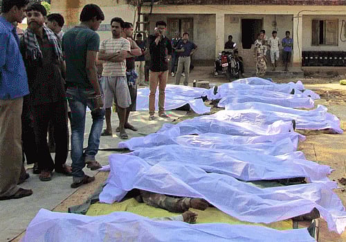 Bodies of paramilitary soldiers killed in an ambush lay on the ground outside a police station in Sukma district, in the eastern Indian state of Chhattisgarh, Tuesday, March 11, 2014. Maoist rebels ambushed paramilitary soldiers in a brazen daytime attack on their camp in central India on Tuesday, killing 20 troops in their largest attack in almost a year, police said. AP