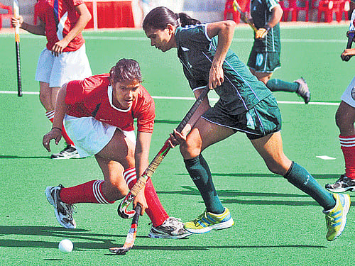 Haryana's Jyoti Gupta (right) and SAI's Sakshi Loyal vie for possession during their tie on Saturday. DH Photo