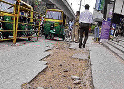 POOR MAINTENANCE:  Pavements are in bad shape even  in the city's Central Business  District. Broken tiles, potholes  and filth are everywhere.