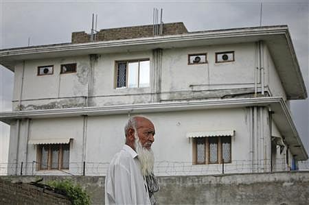 Former ISI chief Lt Gen Ahmed Shuja Pasha knew of Osama bin Laden's hideout in Pakistan and LeT founder Hafiz Saeed was in regular contact with the slain al-Qaeda chief, a media report said today. Reuters File Photo