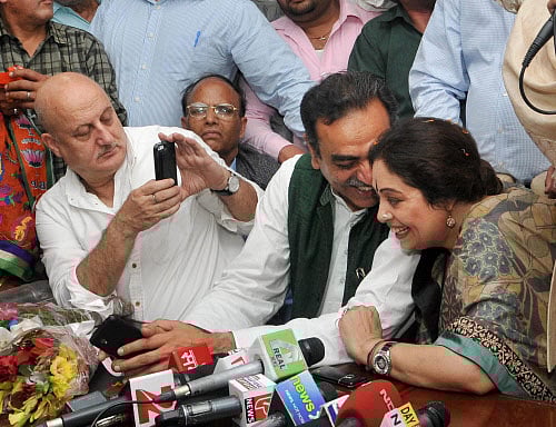 Anupam Kher says neither he and nor his wife Kirron Kher were disturbed when she was greeted with eggs and black flags on her arrival in Chandigarh as the Bharatiya Janata Party (BJP) candidate for the forthcoming Lok Sabha elections. PTI photo
