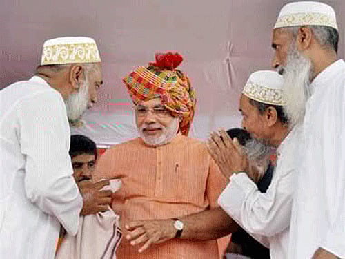 Some members of the minority community in Bangalore questioned BJP prime ministerial candidate Narendra Modi's decision not to wear a skull cap offered to him by a Muslim cleric during a public rally in Gujarat in 2011. Modi during his Sadbhavana yatra. PTI File Photo