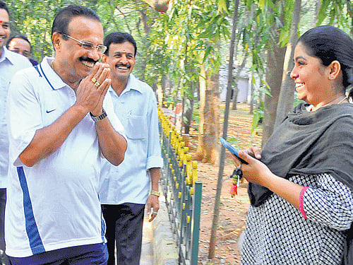 BJP candidate from Bangalore North Lok Sabha constituency D V Sadananda Gowda seeks support of a morning walker in Bangalore on Sunday. Dh photo