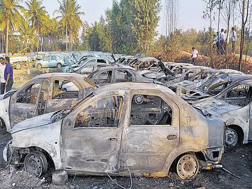 As many as 24 cars, valued at Rs 40 lakh, were destroyed in an accidental fire at a car dump yard in Kadubisanahalli on Monday. DH Photo