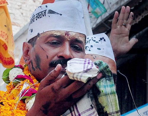 AAP leader Arvind Kejriwal Tuesday vowed to defeat BJP's prime ministerial candidate Narendra Modi after arriving here amid hostility from Modi supporters that triggered an ink attack. PTI